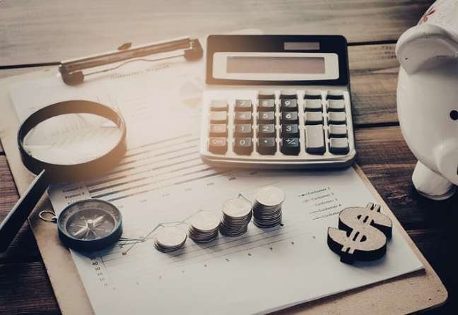Calculator, coins and finances