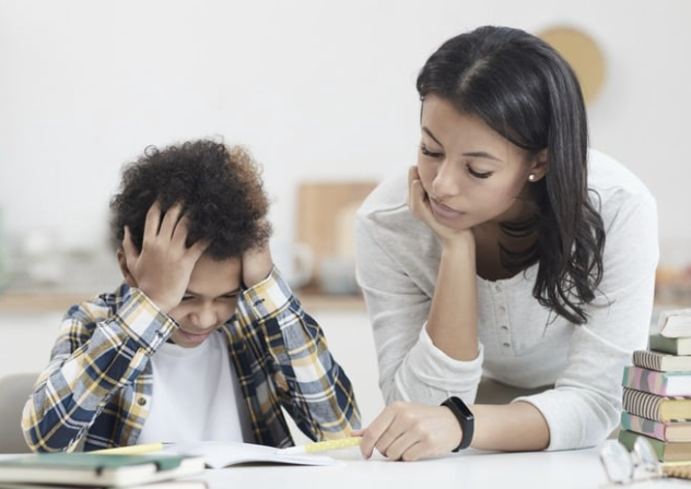 Parent helping child with homework