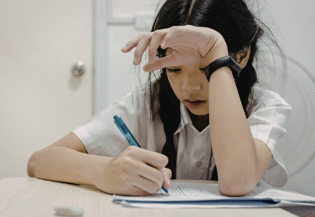 Stressed student studying